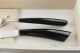 pair of Noble cutlery, black resin