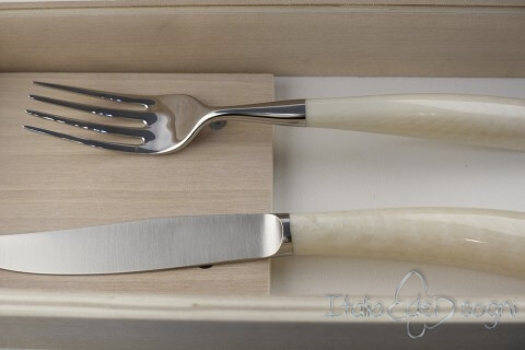 pair of Noble cutlery, ivory resin